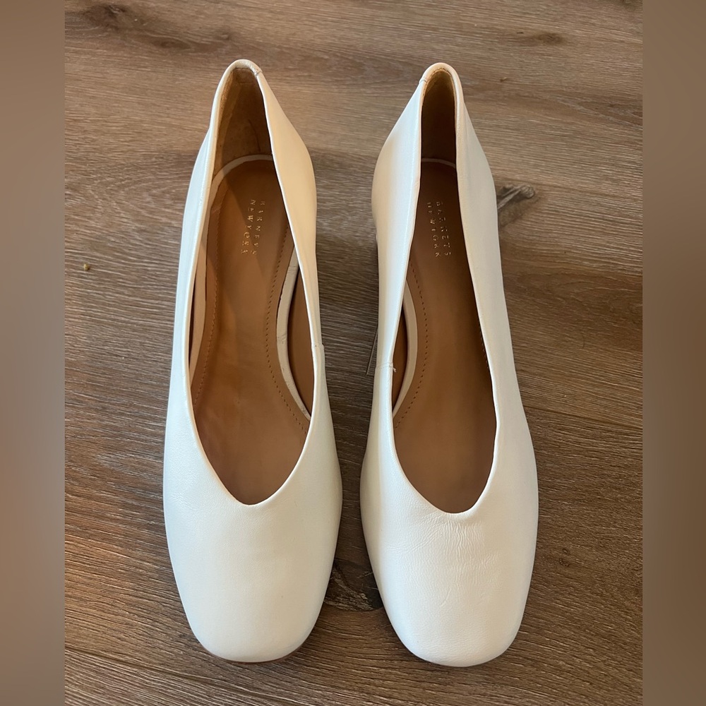 Barney’s white heels